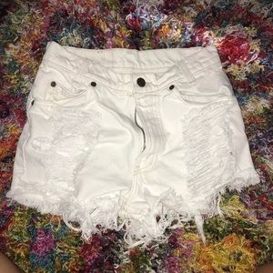 White destroyed Levi’s high waisted shorts